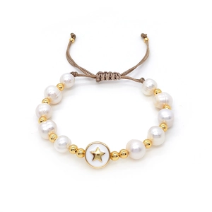 Close-up of woven baroque pearl bracelet featuring a star pendant and adjustable slider knot
