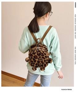 Detail of plush leopard print toddler backpack showing texture and stylish fit on back
