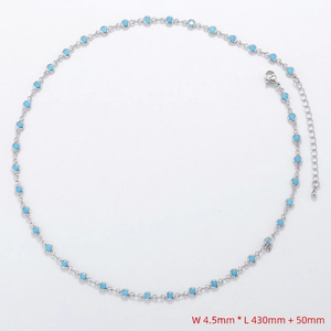 Detail of silver chain necklace with inlaid blue round stones showing length and width dimensions