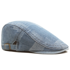 Retro denim patchwork flat cap with woven textures and side metal buckle in blue tones
