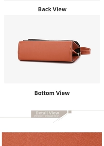 Close-up of the orange crossbody bag base with pebbled leather and white stitching