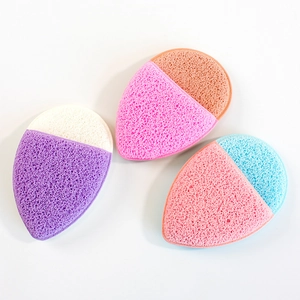 Macro detail of three multi-colored teardrop sponges with porous deep cleaning texture