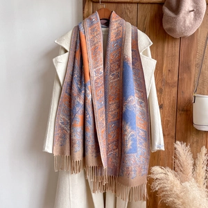Detailed shot of ethnic pattern polyester cotton scarf with elegant fringe and tassels