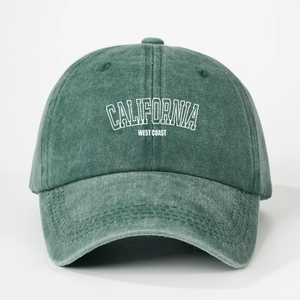 Detailed view of washed green baseball cap with white CALIFORNIA WEST COAST letter print
