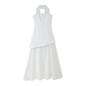 Detail of white off-shoulder midi dress with asymmetrical layered hem and halter neckline