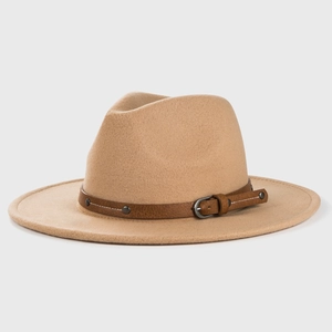 Detailed macro view of camel wool fedora hat with brown leather belt and metal buckles