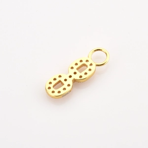 Macro view of 925 sterling silver gold-plated infinity pendant with gemstone settings