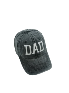 Close-up of vintage washed cotton baseball cap with white 3D DAD embroidery on the front