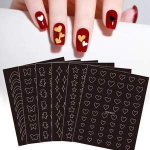 Detail of WW8001 nail stickers with gold and white hearts stars and butterfly patterns