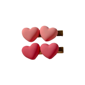 Pink heart-shaped hair clips for women and kids in light and dark shades with gold metal