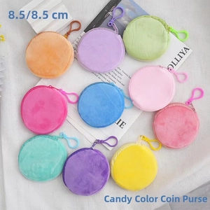 Flat lay of 10 colorful mini plush coin purses with zippers and hooks, 8.5x8.5 cm size