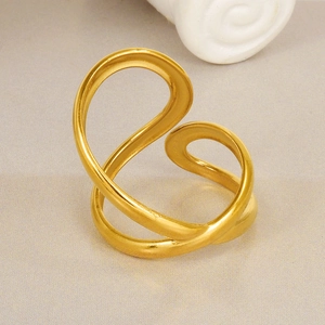 Detailed view of the winding gold line design on a minimalist 18k gold-plated ring