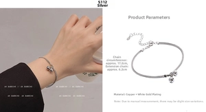 Macro shot of silver plated bell bracelet with detailed length and material specifications