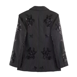 Back view of black pinstripe blazer with intricate floral sequin embroidery details