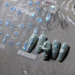 Detailed blue iridescent floral nail stickers with tassel and calligraphy on green tips