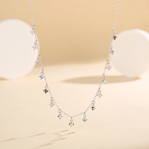 Detailed macro view of S925 sterling silver chain with tiny colorful zircon tassels