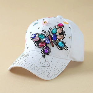 White baseball cap with colorful rhinestone butterfly and silver rivet decorations