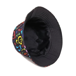 Reversible bucket hat with colorful music notes print and black lining for sun protection
