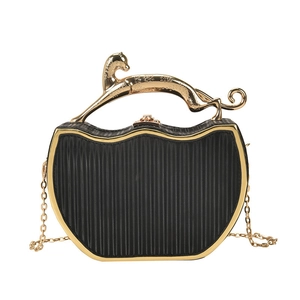 Elegant black box bag with golden leopard handle and chain strap on white background
