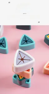 Close-up of colorful triangular silicone towel holders in various Nordic pastel shades