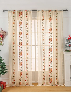 Detail of Christmas lace curtain with red bells embroidery and pole pocket design