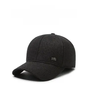 Detail of grey winter baseball cap showing thick wool texture and sports style metal plate