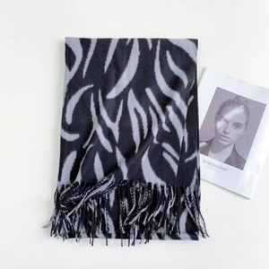 Detailed view of striped zebra pattern cashmere scarf with delicate fringed edges