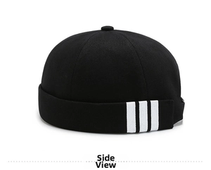 Close-up side view of black canvas miki hat featuring three white stripes and top button