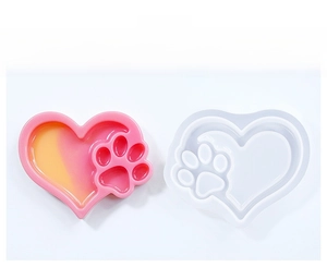 Macro detail of heart-shaped cat paw silicone mold for DIY resin storage tray making