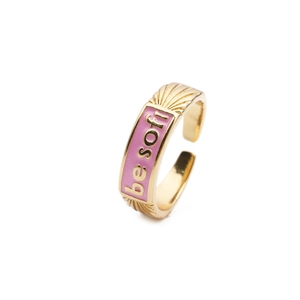 Gold plated adjustable ring featuring pink enamel inlay and BE SOFT slogan engraving