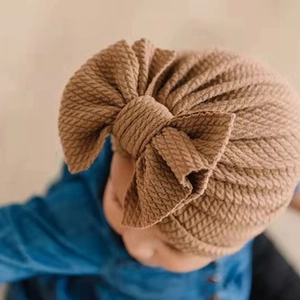 Newborn waffle knit turban hat with large double bow in caramel brown for autumn and winter