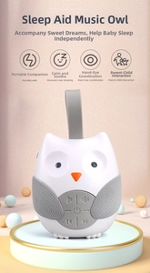 Macro detail of owl baby sleep soother with control buttons and soft texture