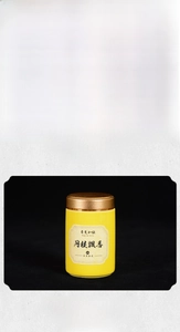 Macro detail of Osmanthus incense powder in green and yellow glass jars with bronze lids
