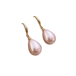 Elegant pink teardrop imitation pearl earrings with gold hooks on a white background