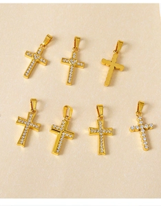 Detailed collection of golden cross pendants with shimmering zircon stones and heart accents