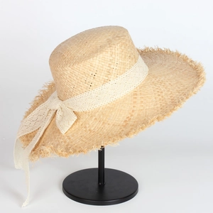 Handmade raffia straw sun hat with lace bow and frayed brim for summer beach vacation