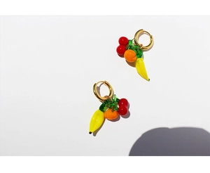 Detail of 18K gold plated hoop earrings with glass cherry, banana and orange charms