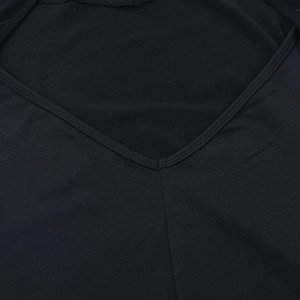 Detailed close-up of the V-shaped stitching and mesh fabric on this black sexy dress