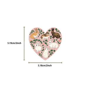 Detailed size view of heart-shaped pink rabbit stickers measuring 2 inches in width