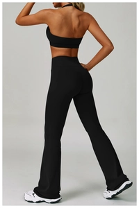 Back view of black two-piece yoga set with racerback bra and high waist flare leggings