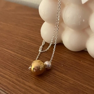 Minimalist 925 sterling silver necklace featuring elegant gold and silver double beads