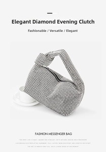 Detailed view of silver rhinestone evening bag with elegant knotted handle on white desk