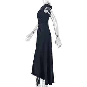 Detail of a black one-shoulder maxi dress featuring side slit and pleated waist design