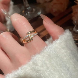Macro shot of double-layered 18k gold plated T-design ring with pavé cubic zirconia