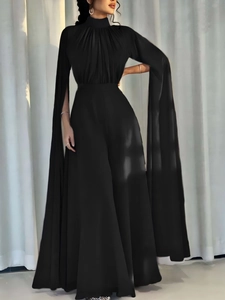 Elegant black high-neck maxi dress with long split cape sleeves and a slim waistline
