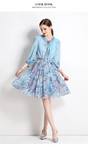 Close-up of chiffon floral dress featuring ruffled stand collar and delicate bow tie detail