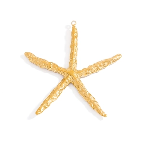 Macro detail of a golden starfish pendant with textured surface and top hanging ring