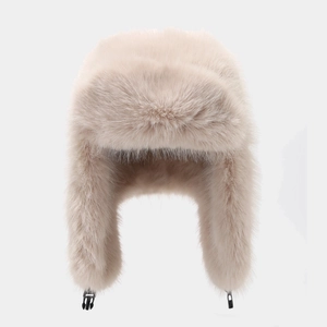 Pluffy beige faux fox fur earflap hat with adjustable buckle closure for winter warmth