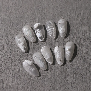 White and grey matte press-on nails set with 3D swan, rose, and pearl embellishments