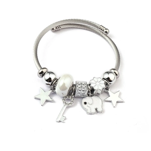 Detail view of silver charm bracelet with white beads, star and elephant pendants